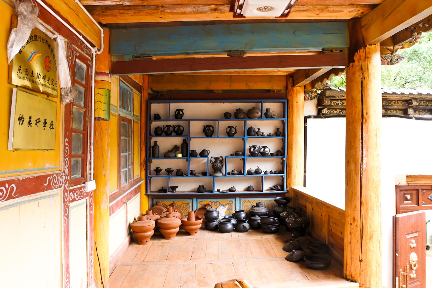 Finished pottery on the shelves of a partner workshop